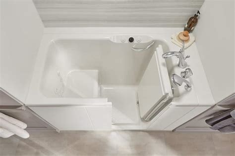 A basic walk-in tub with only standard safety features can cost anywhere from 2,000 to 5,000. . Walk in tub kohler